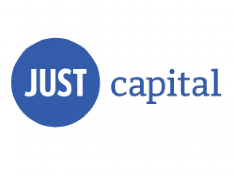 A blue circle with the words just capital underneath it.